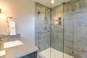 a bathroom with a shower and a sink at Dogwood Farmhouse in Candler +14 photos