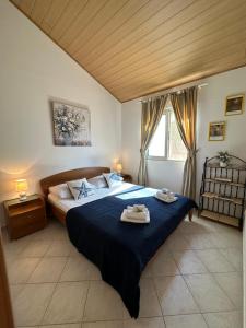 Postel nebo postele na pokoji v ubytování Apartments Marija