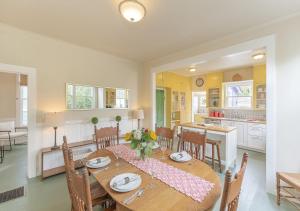 a kitchen and dining room with a table and chairs at 3893 Sweet Seventeenth home in Pacific Grove