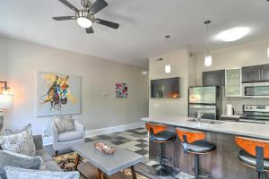 a kitchen and living room with a bar and chairs at Historic King James Unit 5 in Asheville