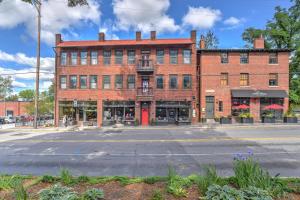 a large red brick building on a street at Historic King James Unit 5 in Asheville