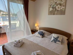 Postel nebo postele na pokoji v ubytování Apartments Marija