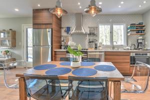 a kitchen with a wooden table with chairs around it at 503 Webb Cove Rd in Asheville