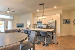 a kitchen and dining room with a table and chairs at 55 South Market Condo 216 in Asheville