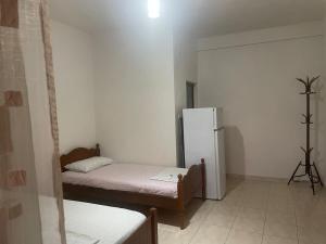 Postel nebo postele na pokoji v ubytování Ibras House