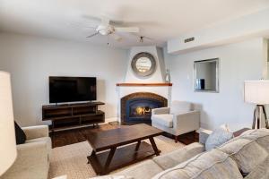 a living room with a couch and a fireplace at 8 Village Lane 201 in Asheville