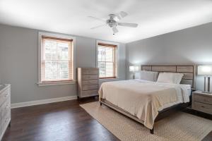 a bedroom with a bed and a ceiling fan at 8 Village Lane 201 in Asheville