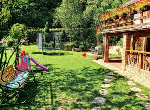 a park with a playground with a bench and a swing at Banja Luka house - Casa Rustica in Banja Luka +12 photos
