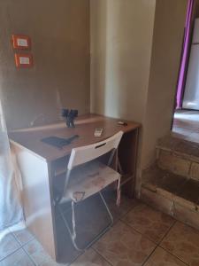 a small bathroom with a sink and a shelf at SPELTAUR B&B in Spoltore