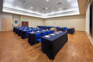 a conference room with blue tables and blue chairs at City Express by Marriott Xalapa in Xalapa