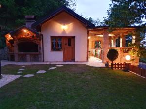 a house with a porch and a yard at Banja Luka house - Casa Rustica in Banja Luka