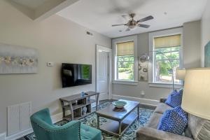 a living room with a couch and a table at Historic King James Unit 4 in Asheville