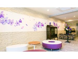 a room with purple and purple stools and a wall with butterflies at Kyoto Four Sisters Residence - Vacation STAY 15222v in Kyoto