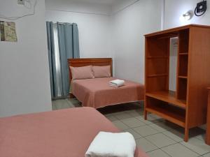 Postel nebo postele na pokoji v ubytování Orquídeas Hotel
