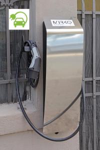 a pay phone is hooked up to a fence at Casa Mirko - B & B con stazione ricarica auto elettriche parcheggio privato auto moto biciclette in Arezzo