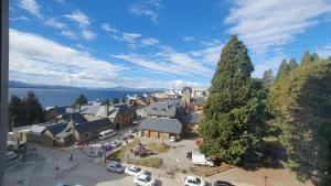 an aerial view of a town with a large tree at Center Vistas in San Carlos de Bariloche