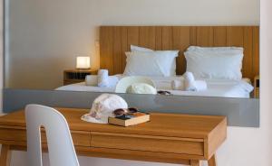 A bed or beds in a room at Ionian Theoxenia