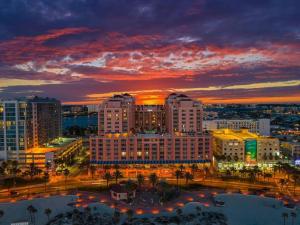 a view of a city at sunset with buildings at Charming 2-Bedrooms Central Clearwater Apartment With Private Backyard in Clearwater