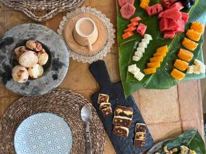 a table with plates of food and a cup of coffee at Casa Cariri- Preá in Prea +20 photos
