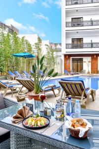 a table with a plate of food on top of a patio at Fes Heritage Boutique luxury Hotel in Fez