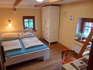 Postel nebo postele na pokoji v ubytování Guest House Sněžník