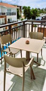 a white table and chairs sitting on a balcony at Deluxe Condo/1BR-1BT/Close to Beach/Pool View in Punta Cana