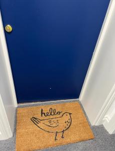 a door with a rug with a banana on it at Sophia's Cwtch in Cardiff