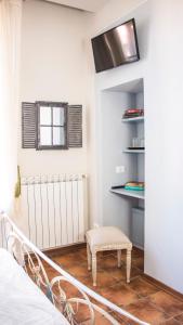 TV a/nebo společenská místnost v ubytování Bed & Breakfast Corte Toro