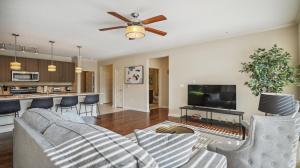a living room with a couch and a tv at Ponce City Market 2 bdrm in Atlanta