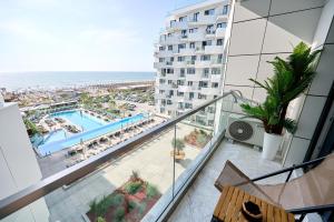 a balcony of a hotel with a view of the ocean at TGM Sunrise View in Infinity Pool & Spa Resort in Mamaia Sat/Năvodari