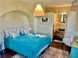 Posteľ alebo postele v izbe v ubytovaní Boutique Hotel Masseria Sottomasi + 37 fotografií