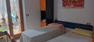 A bed or beds in a room at Casa Lilla 1 e 2