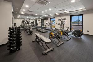 a gym with several treadmills and cardio machines at City Express by Marriott Tepic in Tepic