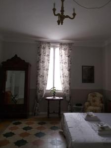 Postel nebo postele na pokoji v ubytování La Falconiera