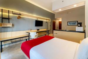 TV a/nebo společenská místnost v ubytování City Express by Marriott Cancun