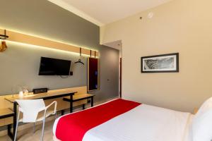 TV a/nebo společenská místnost v ubytování City Express by Marriott Cancun