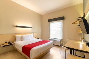 Postel nebo postele na pokoji v ubytování City Express by Marriott Cancun