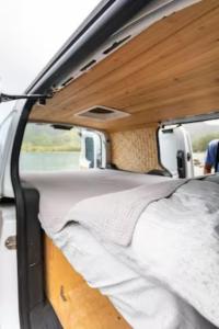 a bed in the back of a camper van at Maleka Farm Camper-Vans in Laie