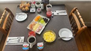 a table with food and drinks on top of it at Hotel Costanera - Caja Los Andes in Valdivia +18 photos