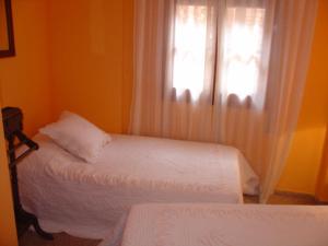 Posteľ alebo postele v izbe v ubytovaní Hostal Restaurante Arasa