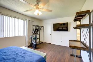 a bedroom with a bed and a ceiling fan at Pet-Friendly Santa Maria Condo with Balcony! in Santa Maria