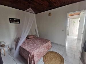 Postel nebo postele na pokoji v ubytování Sur les hauteurs du sud