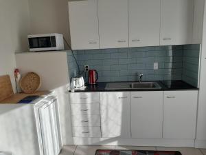 A cozinha ou kitchenette de Moana Vista
