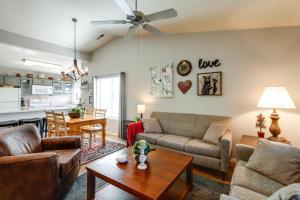 a living room with a couch and a table at Cozy Flagstaff Retreat with Fireplace and Gas Grill! in Flagstaff