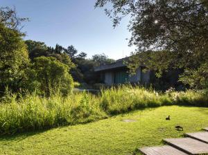 a field of grass with a building in the background at Columbano Suites Accomodations Lisboa - Praça de Espanha, Sete Rios - Bookable parking in Lisbon