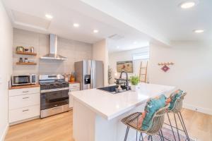 a kitchen with a white counter top and a refrigerator at Reno Oasis: Stylish 1-Bedroom Escape in Reno