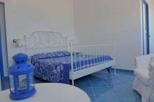 Postel nebo postele na pokoji v ubytování B&B Mammaliturchi SCALA DEI TURCHI
