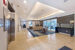 a lobby of a building with a table and chairs at Fairfield Inn & Suites by Marriott Chicago Naperville in Naperville