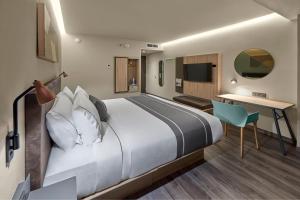 TV a/nebo společenská místnost v ubytování City Express Plus by Marriott Merida