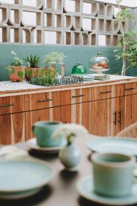 a table with plates and bowls on top of it at Hotel San Fernando in Mexico City